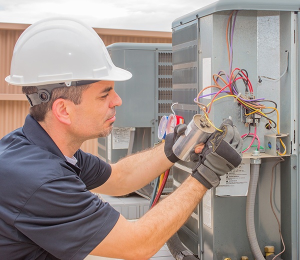 Temp Air heating repair technician identifying ac system sounds.