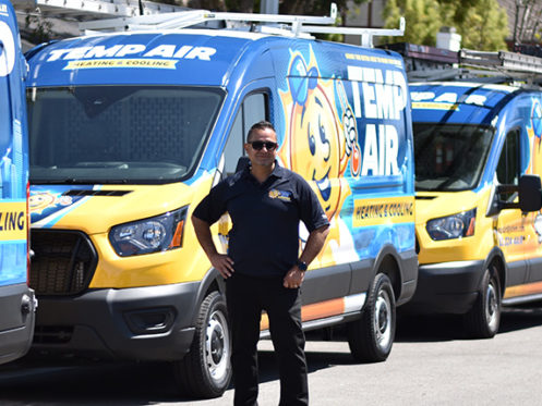 owner with line of new vans. electrical panel upgrades available